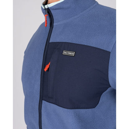 Close-up view of the chest zip pocket on a Saltrock full zip Leo fleece in blue.