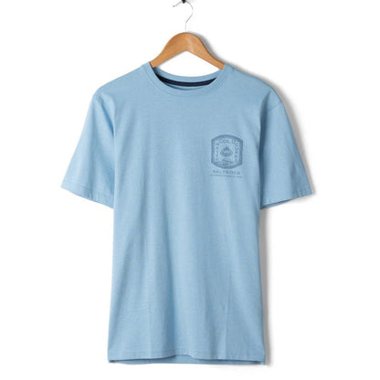 Light blue t-shirt with a logo on a wooden hanger against a white background