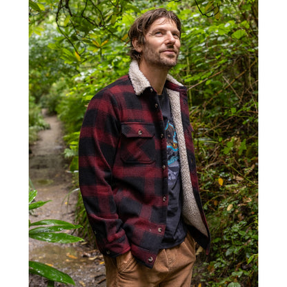 Main front view of a man wearing a Saltrock Fisher Borg lined shacket with a dark red and black check pattern outer fabric and a cream body and collar lining.