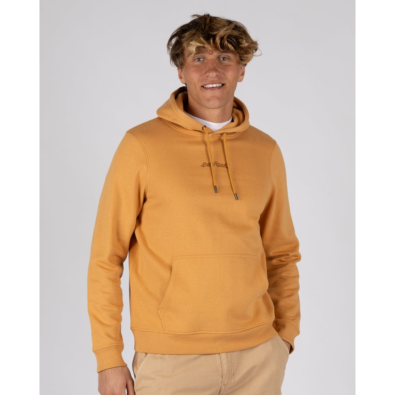 Front view of a man wearing a yellow Saltrock Open Finals Linear pop hoodie  with tummy pocket and elasticated cuffs and bottom hem