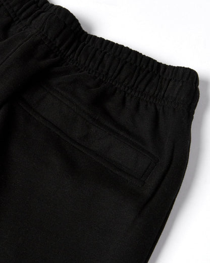 Close up of a back pocket and elastic waist of a pair of mens Saltrock black jogger sweat trousers.