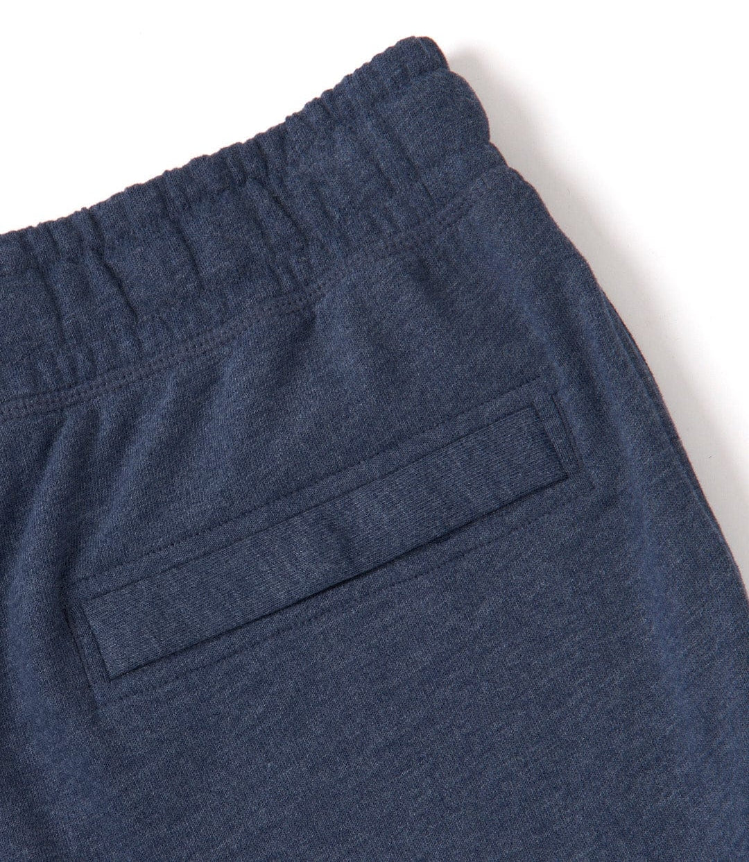 Close-up view of the elasticated waist of a pair of Saltrock men's Original essential sweat shorts in Blue Marl with back pocket.