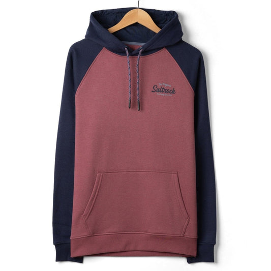 Front view of a mens Saltrock Postcard Script raglan pop hoodie in dark pink with navy blue sleeves and hood