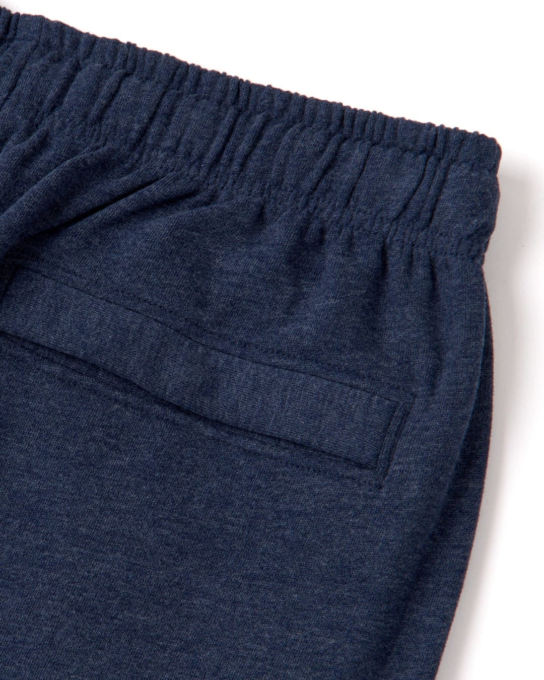 Close up of the elastic waistline and back pocket of a pair of mens Saltrock blue marl jogger sweat trousers on a white background