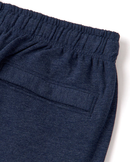 Close up of the elastic waistline and back pocket of a pair of mens Saltrock blue marl jogger sweat trousers on a white background
