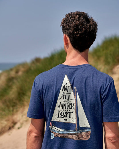 Saltrock mens tee lost ships navy blue with sailboat graphic and quote on back worn outdoors