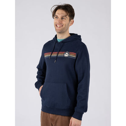 Front view of a man wearing a navy blue Saltrock Tribal Stripe pop hoodie with multicolour stripe print and logo across the chest