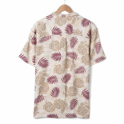 Back view of a mens Saltrock short sleeve Warp Surf Resort shirt in cream with a dark red and tan tropical leaves print
