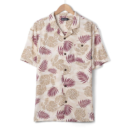 Front view of a mens Saltrock short sleeve Warp Surf Resort shirt in cream with a dark red and tan tropical leaves print