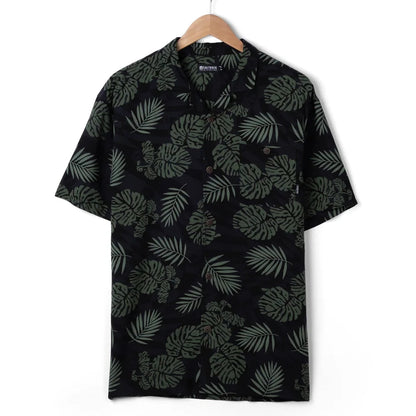 Front view of a mens Saltrock short sleeve Warp Surf Resort shirt in dark grey with a geometric and green tropical leaf print.