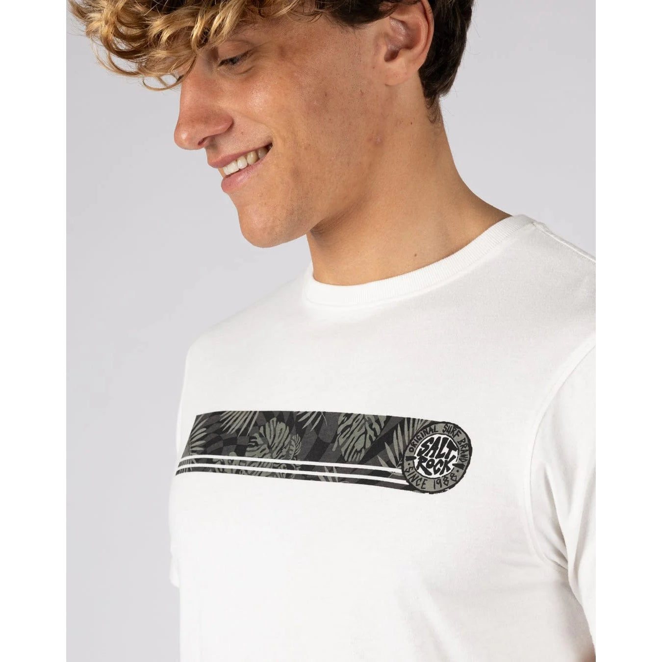 Close-up view of the chest print stripe on a Saltrock short sleeve Warp Surf Stripe t-shirt in cream