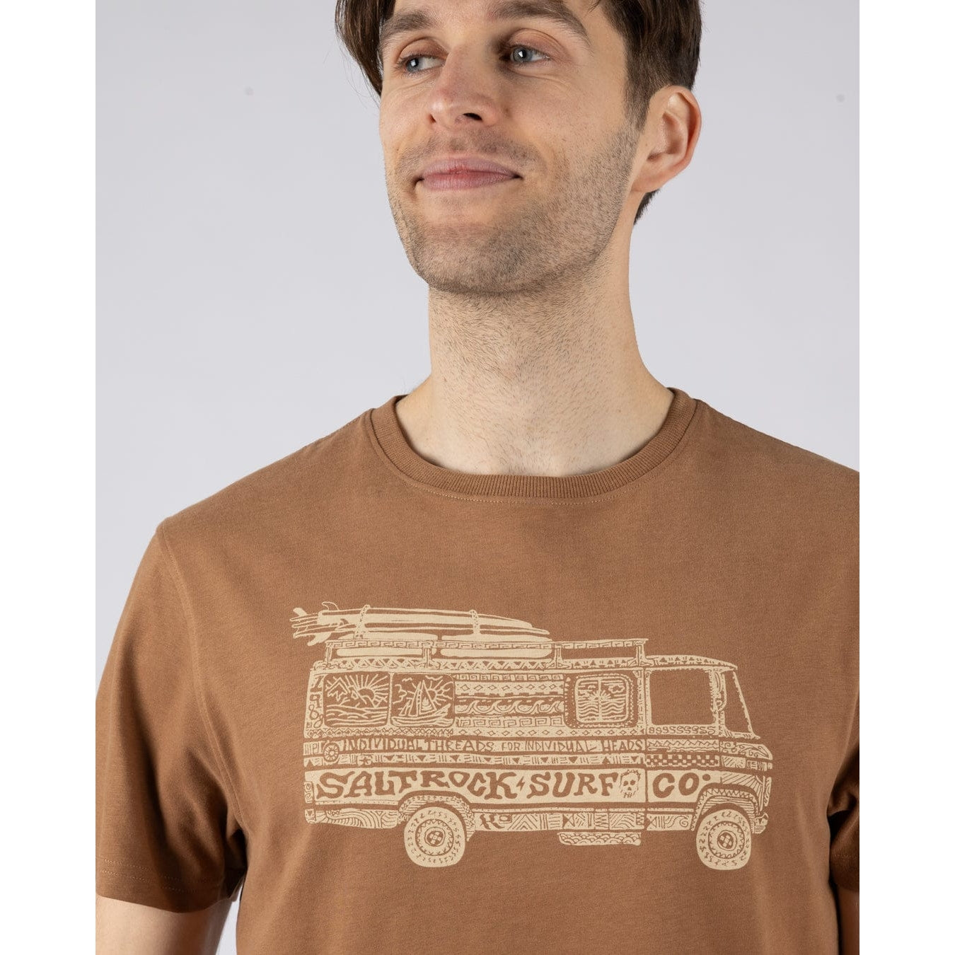 Close-up view of the Trail Bus surf print design on the chest of a mens Saltrock short sleeve t-shirt in brown 