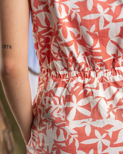 Close-up of Saltrock sleeveless dress coral with floral pattern and elastic waistband detail