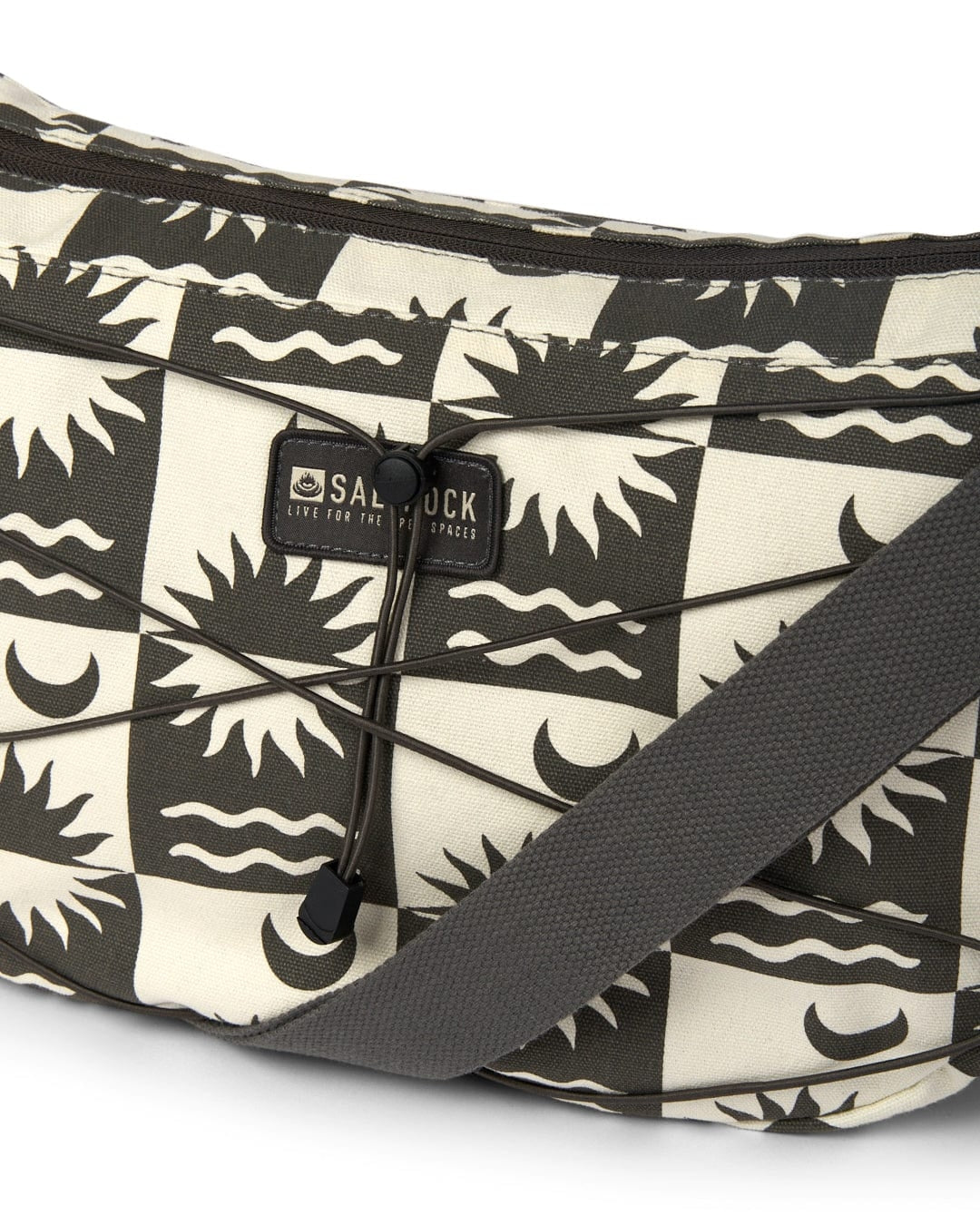 Saltrock sling bag cream featuring a unique sun and waves pattern with adjustable strap