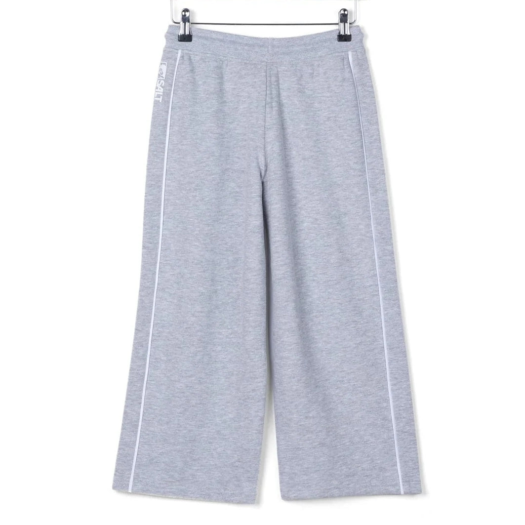 Back view of kids Saltrock Tok Corp jogger trousers in grey with elasticated drawstring waist with white piping down the side of the legs.