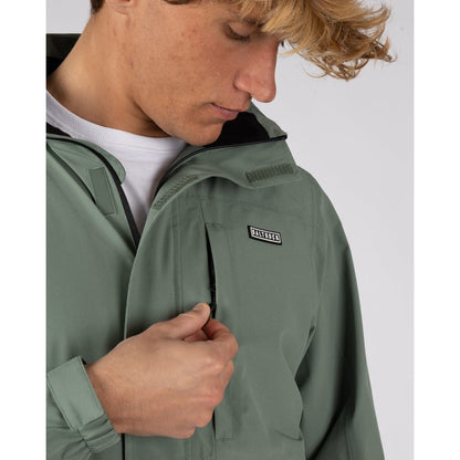 Close-up view of a chest zip pocket on a mens Saltrock Whistler II waterproof hooded jacket in light green