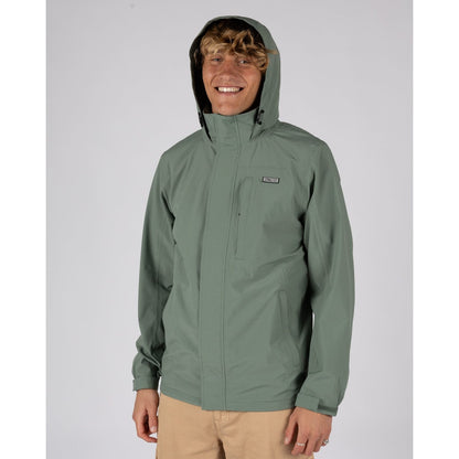 Front view of a man wearing a Saltrock Whistler II waterproof hooded jacket in light green with the hood up