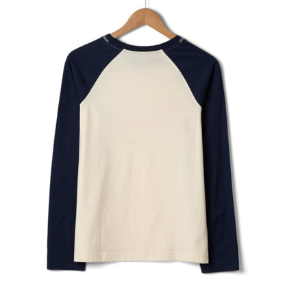 Back view of a womens Saltrock Golden Hour long sleeve raglan t-shirt in cream with navy blue sleeves on a white background