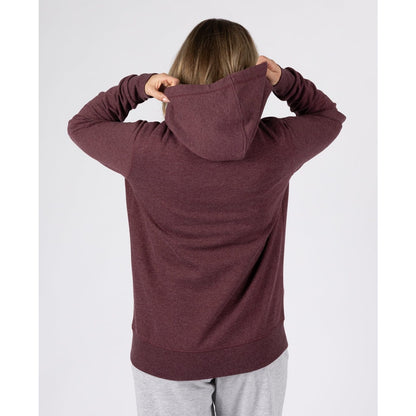 Back view of a woman wearing a Saltrock Velator hoodie in Dark Purple.