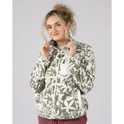 Front view of a woman wearing a Saltrock green floral pattern Balance fleece on a plain background