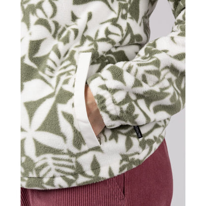 Close-up of a womens Saltrock balance fleece in a green floral pattern with tummy pocket and elasticated cuffs.