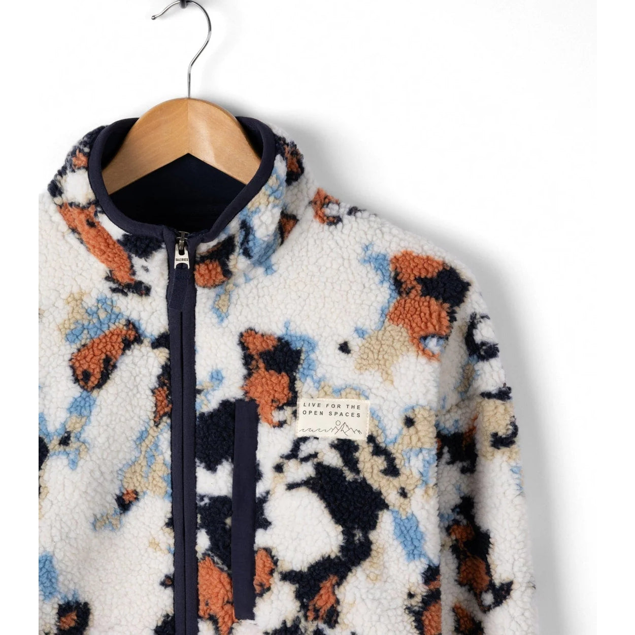 Fluffy patterned Saltrock Folie fleece on a hanger against a white background