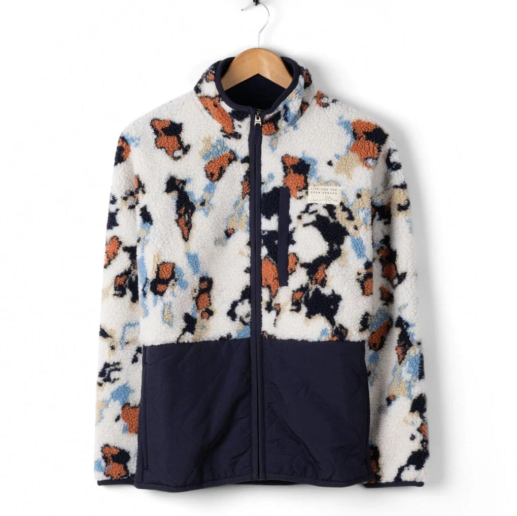 Patterned womens Saltrock Folie fleece with a navy base on a white background.