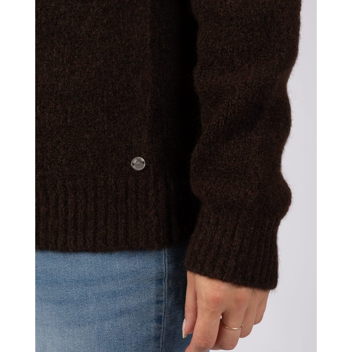 Close-up view of the brown knitted fabric of a womens Saltrock Fern jumper.