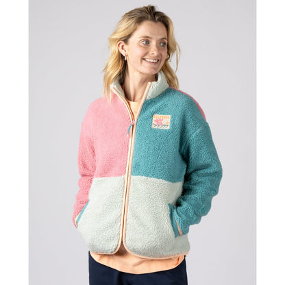 Front view of a woman wearing a Saltrock Emery Wave fleece in pink, turquoise and teal with tummy pockets