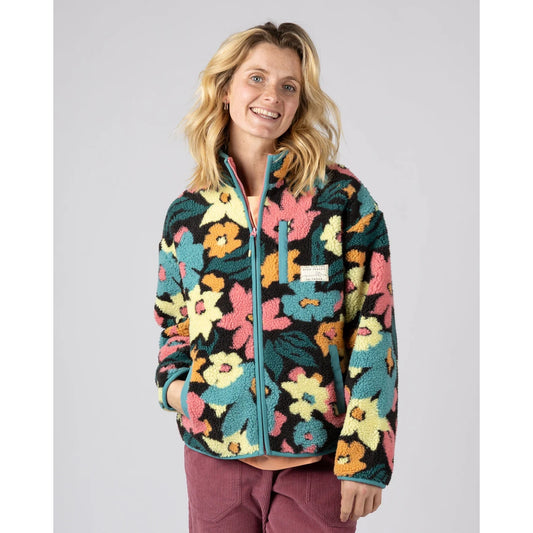 Front view of a woman wearing a Saltrock multicolour floral Holidaze sherpa fleece