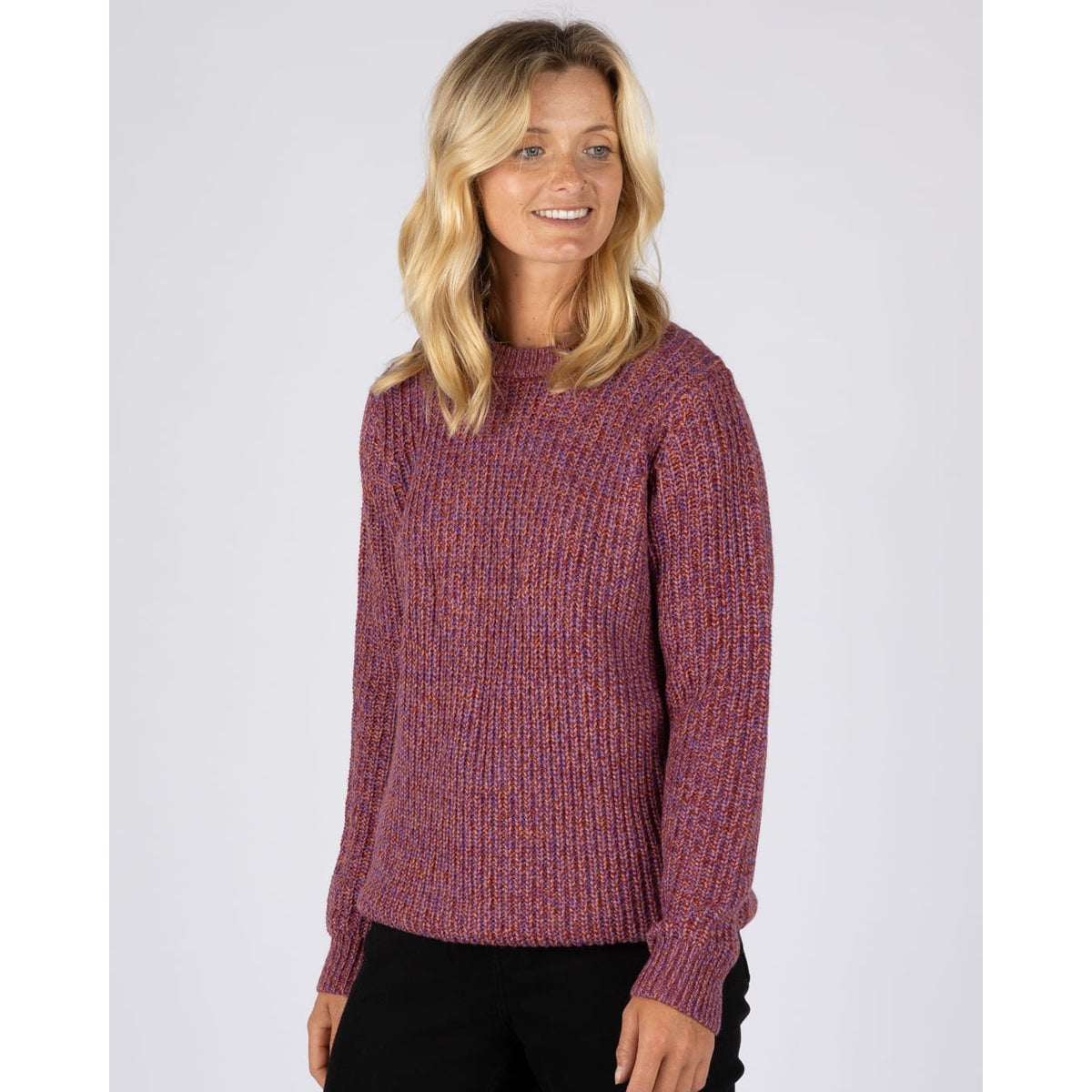 Front view of a woman wearing a Saltrock Lucy crew neck longline knitted jumper in purple.