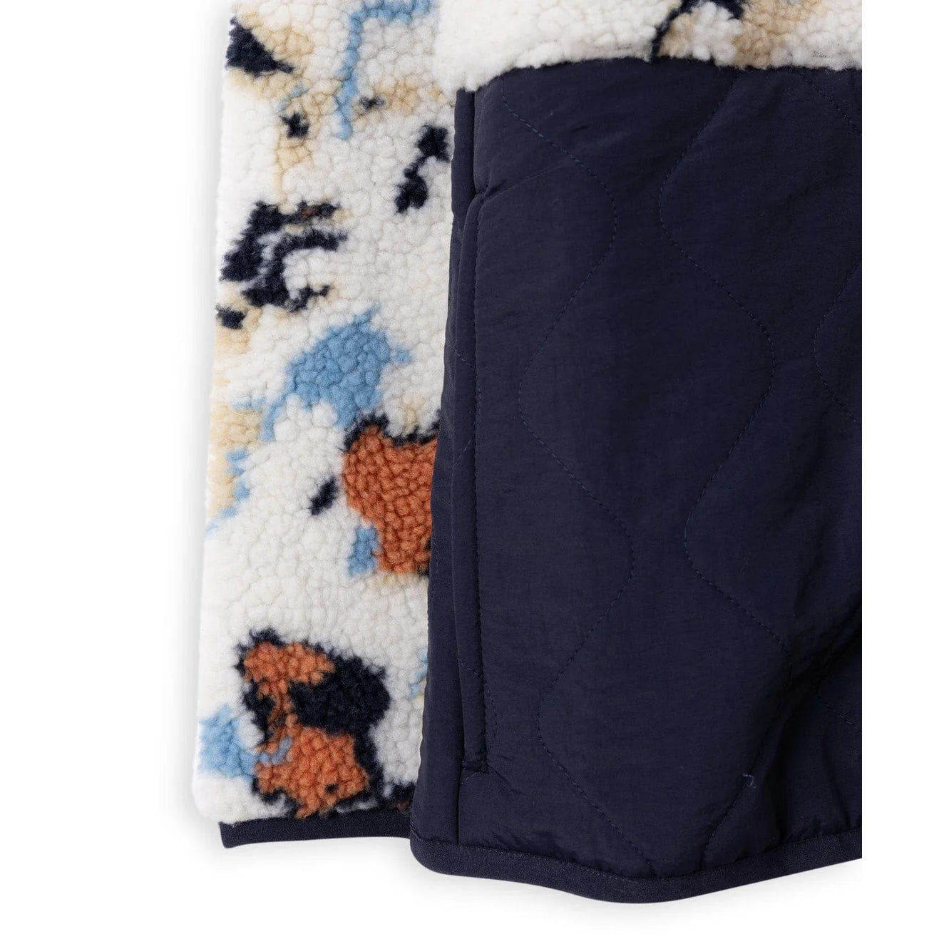 Close-up of a Saltrock womens Folie quilted fleece with a colourful pattern on a white background