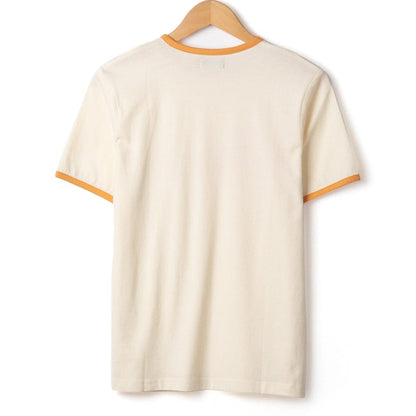 Back view of a womens Saltrock short sleeve Golden Hour t-shirt in cream with orange trim on a white background