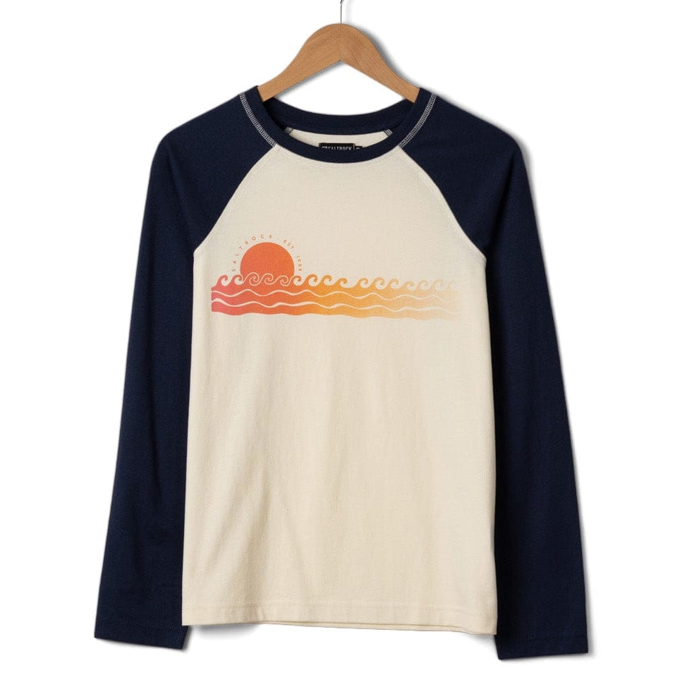 Front view of a womens Saltrock Golden Hour long sleeve raglan t-shirt in cream with navy sleeves and a sea and sunset print across the chest on a white background