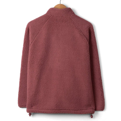 Back view of a womens Saltrock Lya fleece in dark pink on a hanger against a white background