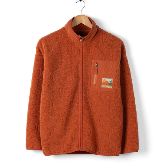 Saltrock womens orange Jarvis fleece jacket with a patch on a white background