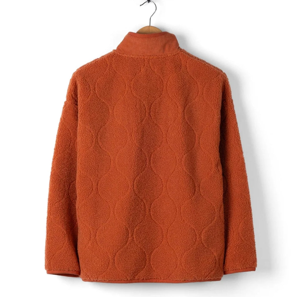Orange Saltrock womens Jarvis jacquard pattern fleece on a hanger against a white background