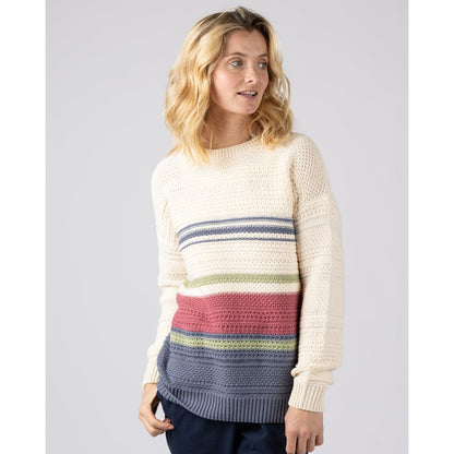 Front view of a woman wearing a cream Saltrock knitted Sable jumper with colourful horizontal stripes