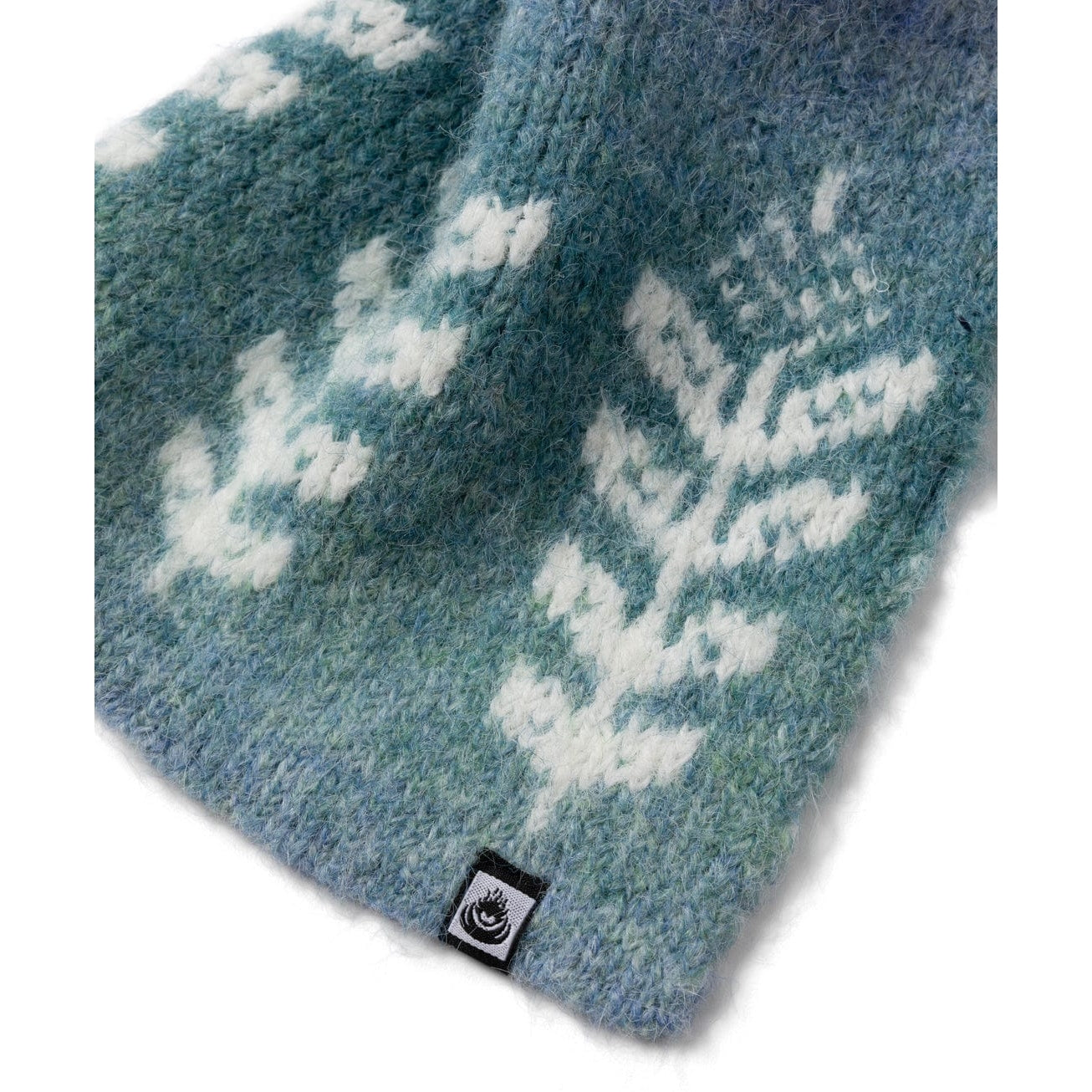 Blue knitted Saltrock Quiver scarf with white floral pattern on a white background