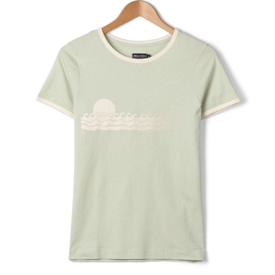 Front view of a womens Saltrock short sleeve Golden Hour t-shirt with sunset and sea print on the chest in Light Green on a hanger with a white background