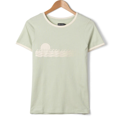 Front view of a womens Saltrock short sleeve Golden Hour t-shirt with sunset and sea print on the chest in Light Green on a hanger with a white background