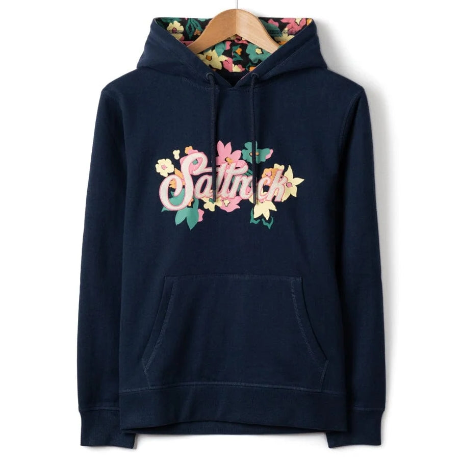 Front view of a womens Saltrock navy blue Trader Daze floral logo print and floral lined hood on a white background