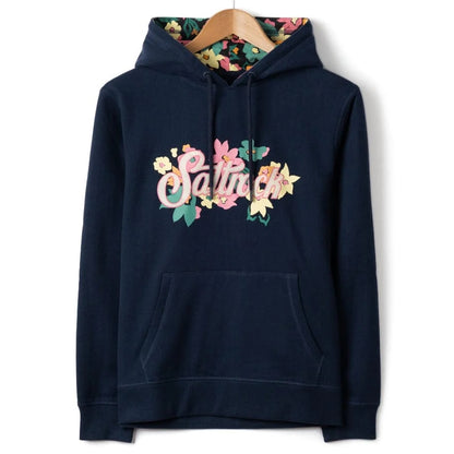 Front view of a womens Saltrock navy blue Trader Daze floral logo print and floral lined hood on a white background