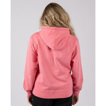 Back view of a woman wearing a bright pink Saltrock Trader Tonal pop hoodie on a plain background