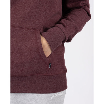 Close-up view of the tummy pocket of a womens Saltrock Velator hoodie in Dark Purple.