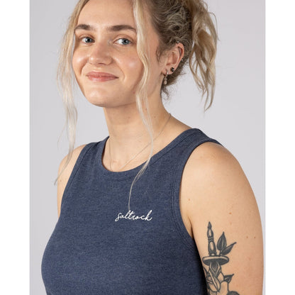 Close-up view of a woman wearing a Saltrock Velator essential vest in Blue Marl with a small white chest logo on a plain background