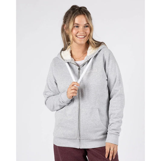 Front view of a woman wearing a Saltrock full zip Velator borg lined grey hoodie on a light grey background