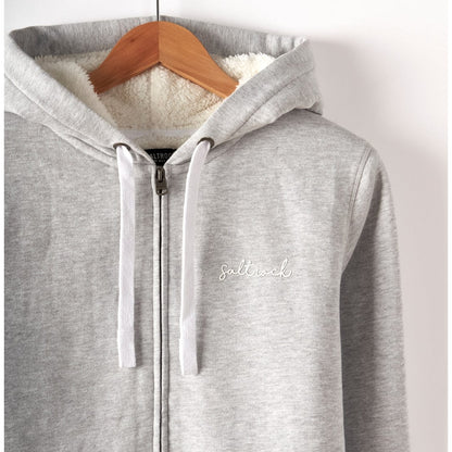 Close-up of a womans Saltrock full zip borg lined grey Velator hoodie with small chest logo on a wooden hanger against a white background