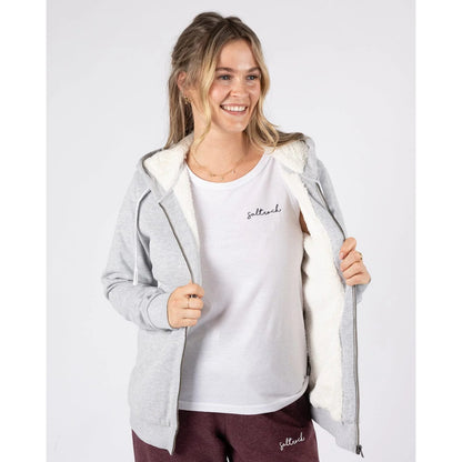 Woman wearing a grey Saltrock Velator full zip borg lined hoodie with a white t-shirt underneath on a white background