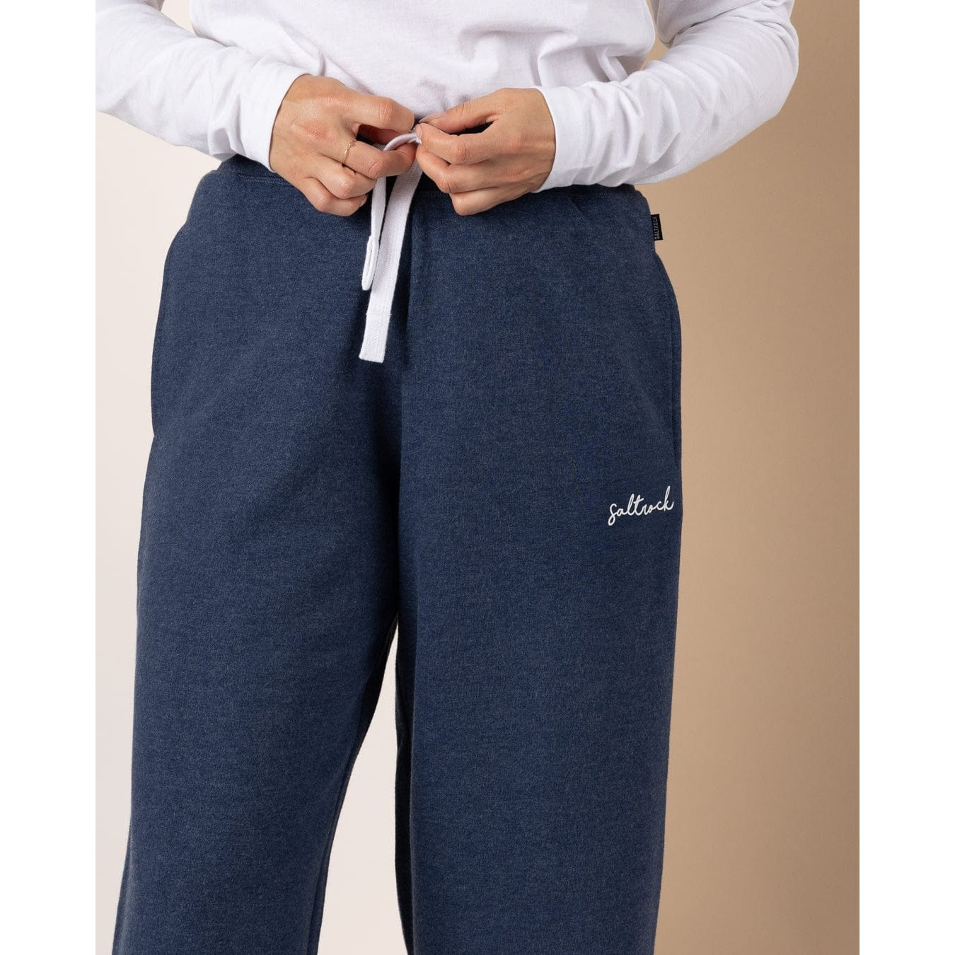 Saltrock Velator blue marl sweat trousers with a brand logo on a beige background